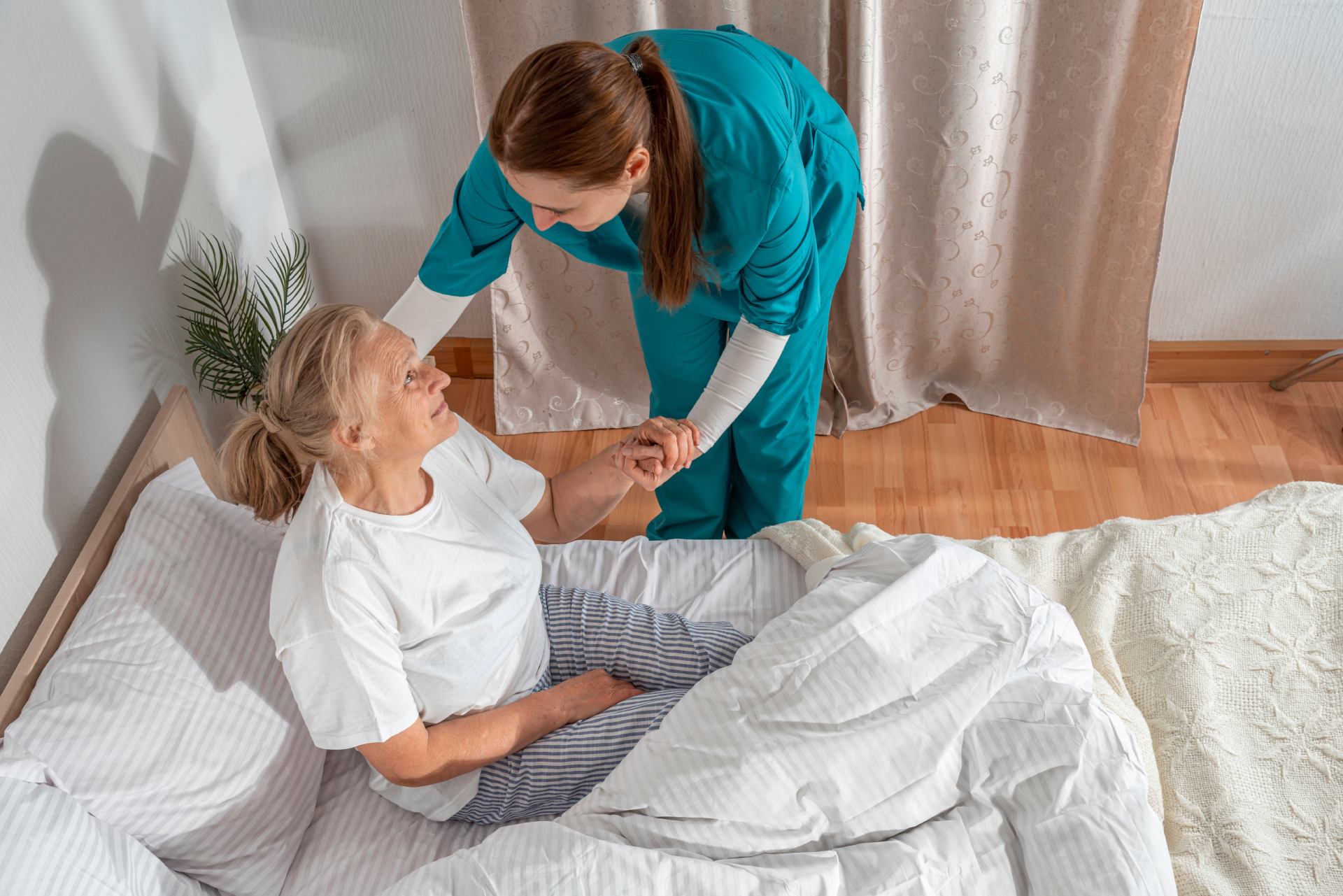 Healthcare worker assisting patient