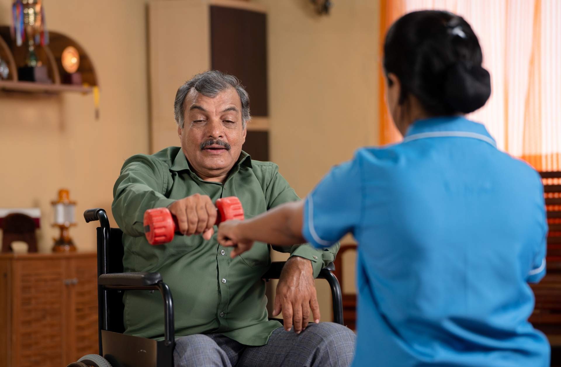 Senior man exercising with weights