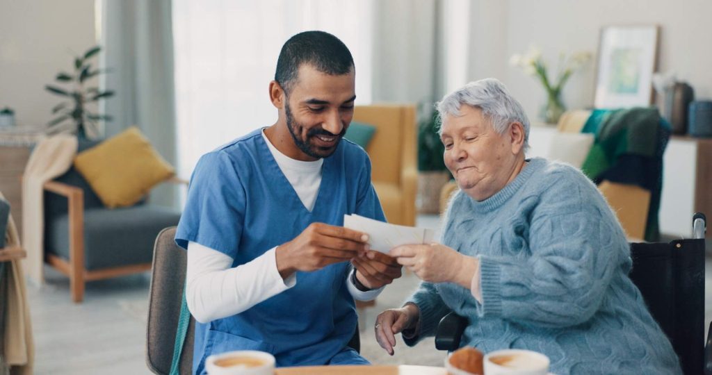 Caregiver and elderly woman smiling