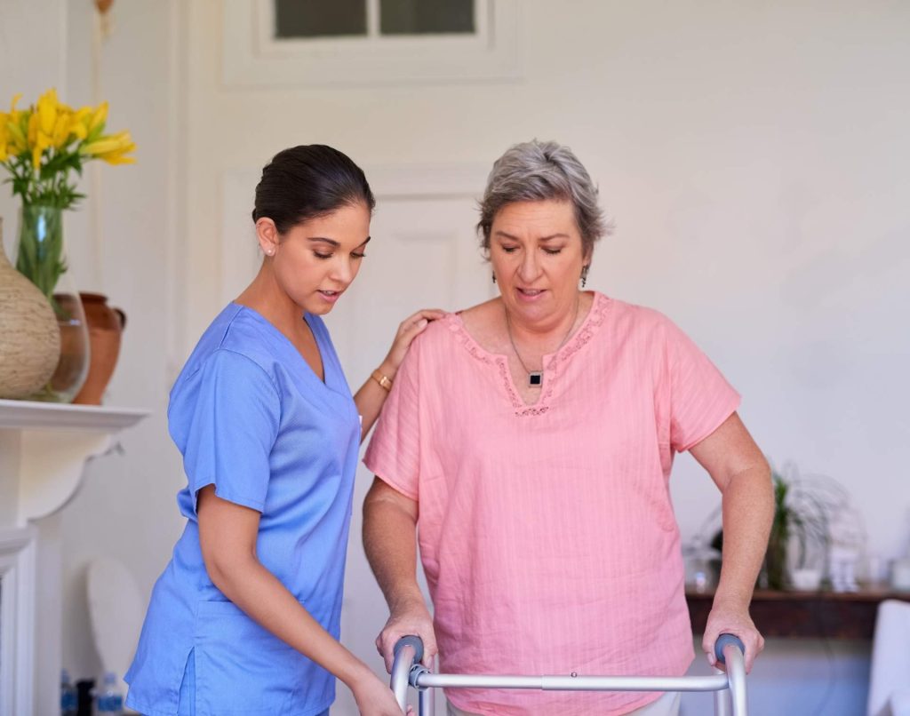 Caregiver assisting older woman