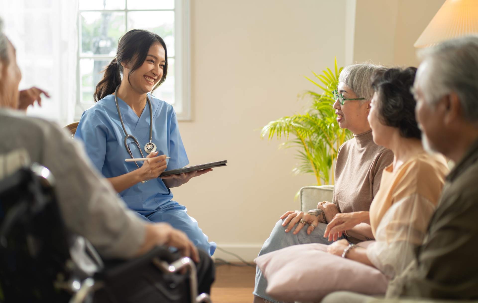 Nurse with seniors in discussion